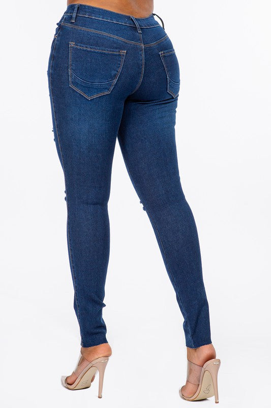 Distressed Mid Rise Skinny Jeans